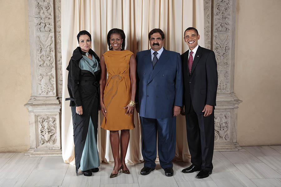 President Barack Obama and First Lady Michelle Obama pose for a photo during a reception at the Metropolitan Museum in New York with, His Highness Sheikh Hamad Bin Khalifa Al-Thani Emir of the State of Qatar and H.H. Sheikha Mozah Consort of H.H. The Emir of the State of Qatar, Wednesday, Sept. 23, 2009. (Official White House Photo by Lawrence Jackson) This official White House photograph is being made available only for publication by news organizations and/or for personal use printing by the subject(s) of the photograph. The photograph may not be manipulated in any way and may not be used in commercial or political materials, advertisements, emails, products, or promotions that in any way suggests approval or endorsement of the President, the First Family, or the White House.