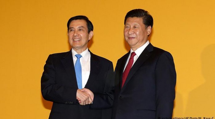 China, Taiwan leaders in historic handshake