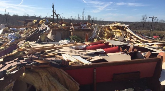 Storms kill at least 14 people Tornadoes, storms kill at least 14 people