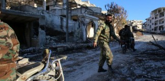 Seizes key rebel-held town in Latakia