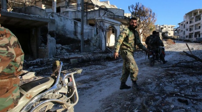 Seizes key rebel-held town in Latakia