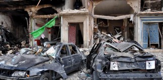 Twin car bombs in Syria kill nearly 50