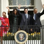 U.S. President Barack Obama, Canadian Prime Minister Justin Trudeau, U.S. first lady Michelle Obama and Sophie Gregoire Trudeau pose from a balcony as they take part in an arrival ceremony for Trudeau at the White House in Washington