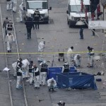 Police forensic experts inspect the area after a suicide bombing in central Istanbul