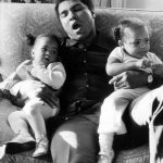 Muhammad Ali yawns while babysitting two of his daughters by wife Veronica Porche