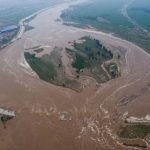 An aerial view shows that roads and fields are flooded in Xingtai