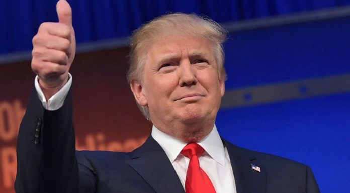 A newly surfaced video shows Donald Trump grabbing and kissing a former Miss Universe onstage