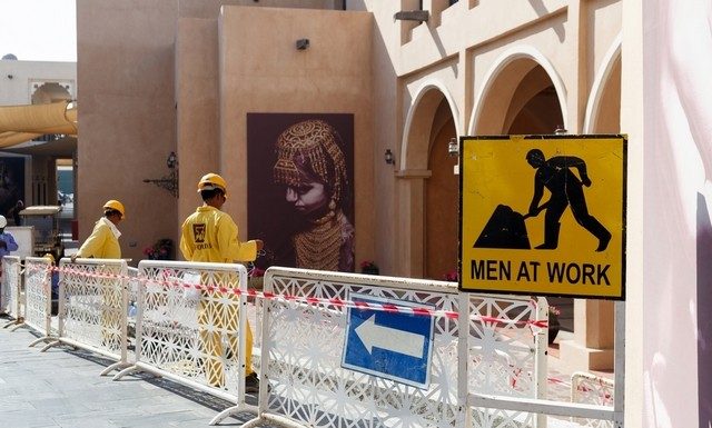 Qatar vows adhering to labour reforms Building work is carried out in Doha's Katara Cultural Village