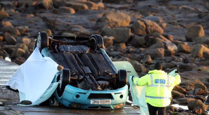 Man found dead in overturned car on path near lighthouse and police have no idea how vehicle got there