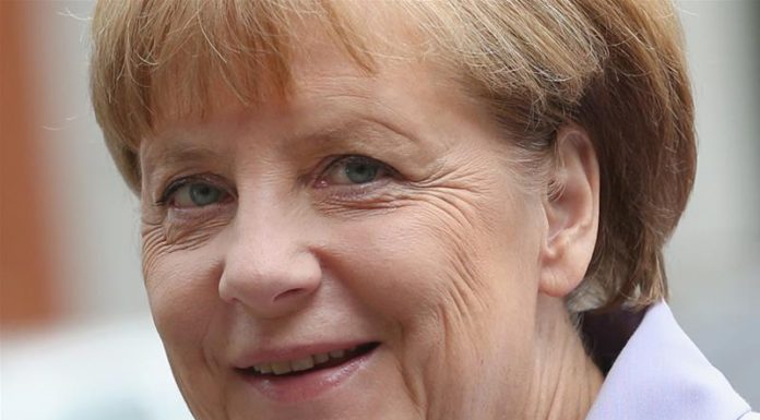 Germany’s Social Democrats back coalition with Merkel