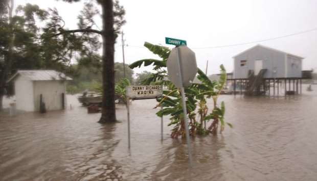 Barry threatens more heavy rain, tornadoes