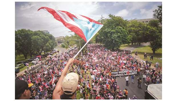 Puerto Rico’s governor quits after mass rallies