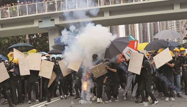 Police fire teargas in Hong Kong clash over anti-triad march