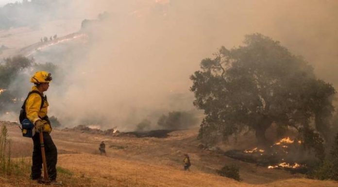 California fires spread, fouling air and spurring evacuations