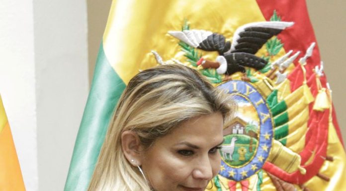 Bolivian interim President Anez withdraws from election race with socialists ahead in polls