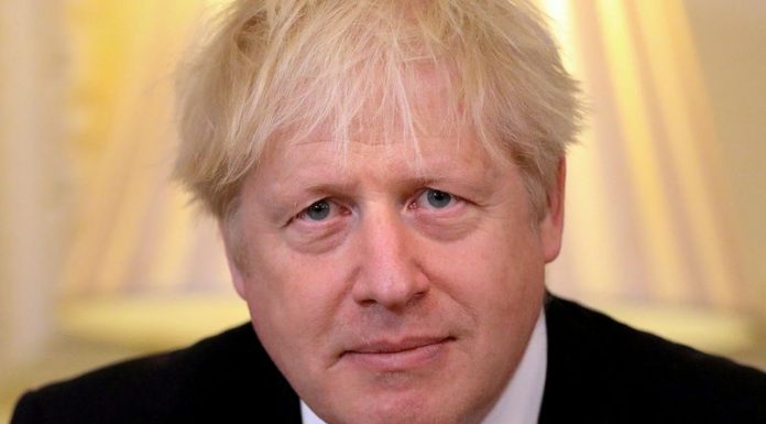 Turning local, British PM Johnson to unveil new coronavirus rules