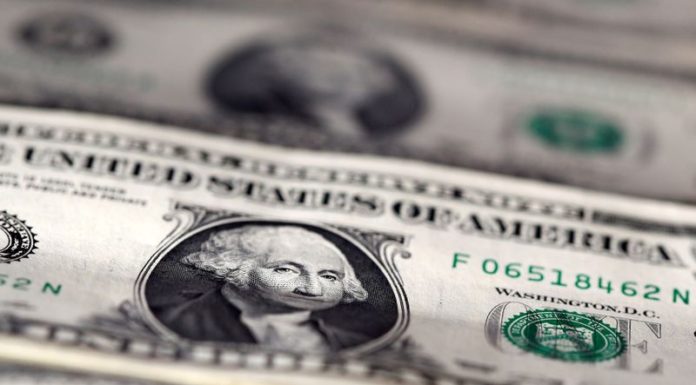 Dollar ends losing week lower on election and COVID aid concerns