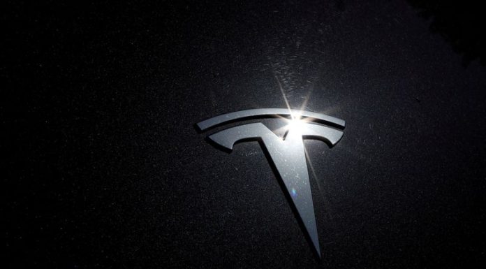Tesla shares rise in busy trade ahead of S&P 500 debut