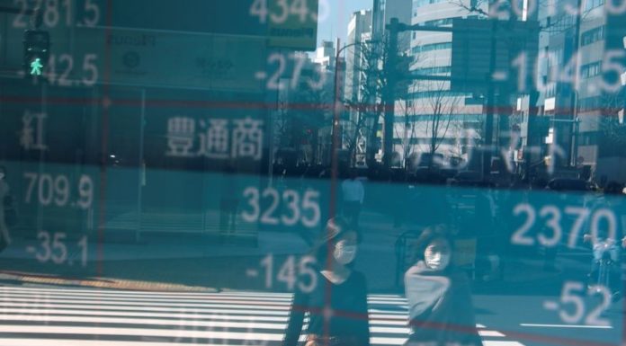 Asian stocks slip as new COVID-19 strain darkens recovery prospects