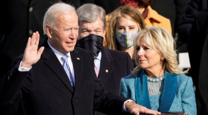 ‘We must end this uncivil war,’ Biden says, taking over a U.S. in crisis