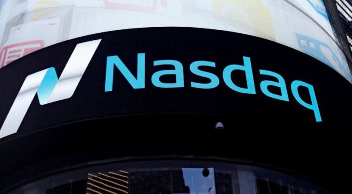 Wall Street closes higher as Fed’s Powell soothes inflation fears