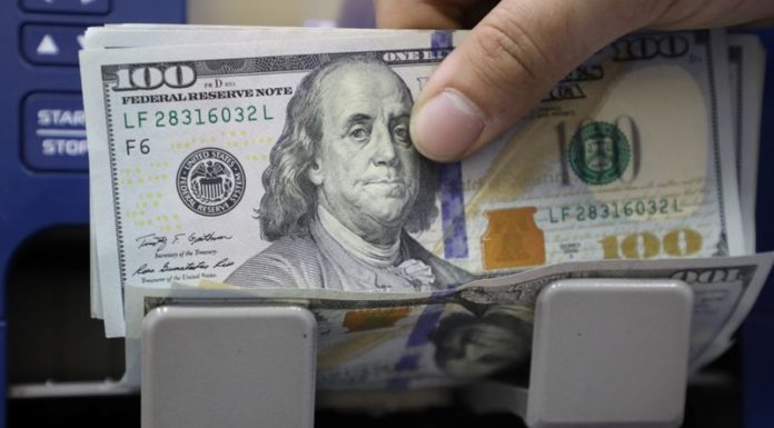 Dollar rebounds from near two-week lows as optimism grows