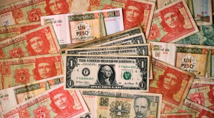 Cuba suspending cash bank deposits in dollars, citing U.S. sanctions