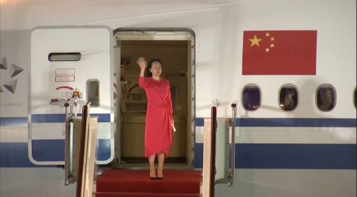 China welcomes Huawei executive home, Trudeau hugs Canadians freed by Beijing