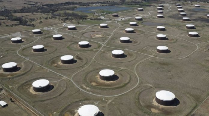 Oil rally hits Omicron demand roadblock as glut worries rise- Reuters poll