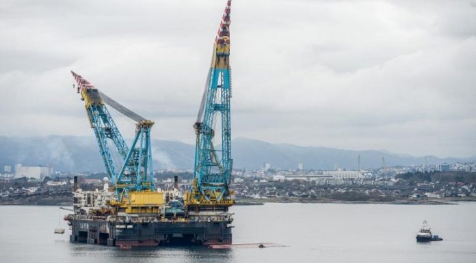 Huge crane ship damaged after partially capsizing in Norwegian port