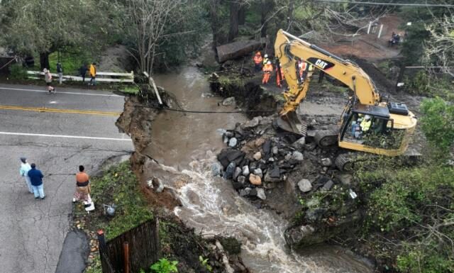 Latest California storm leaves at least two dead and breaks levee