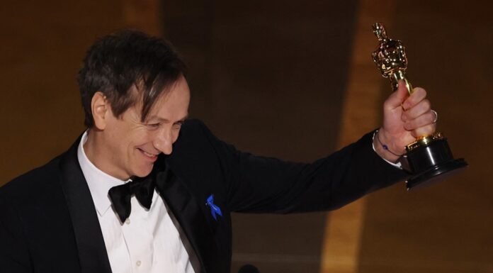 Oscars 2023! Jimmy Kimmel ‘parachutes’ in – and immediately jokes about Will Smith