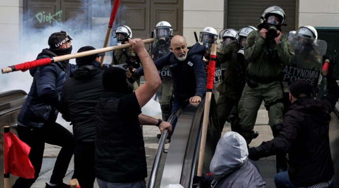 Greece train crash: Fire and violence in Athens as protesters clash with riot police over rail disaster