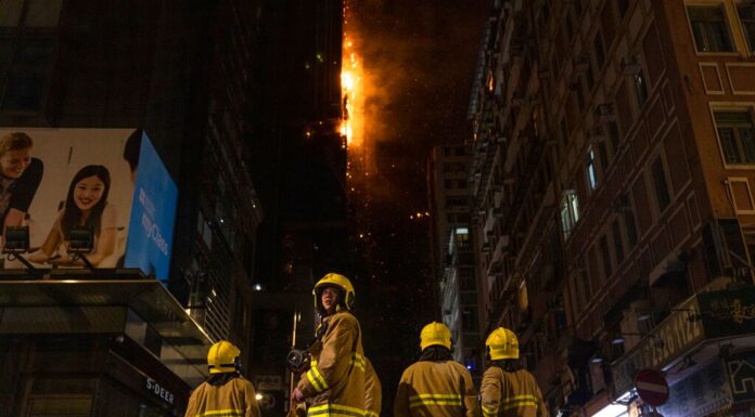 Hong Kong firefighters battle high-rise blaze in popular shopping district