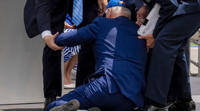 President Joe Biden trips and falls during graduation ceremony