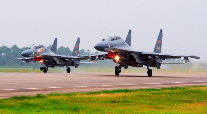 China sends warships and jets near Taiwan as top US official visits Beijing