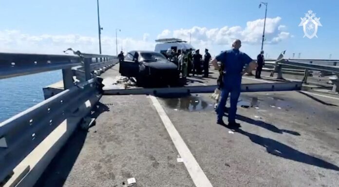 Two dead in explosions on Crimea bridge, says Russia – as it blames Ukraine for attack