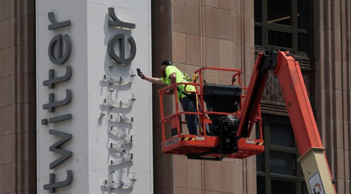 Elon Musk reveals why he’s rebranding Twitter to X – as police disrupt company’s sign removal